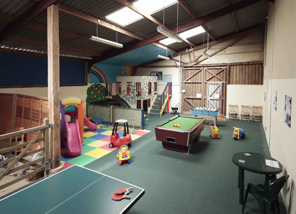 Indoor children's play barn at Long Barn Cottages